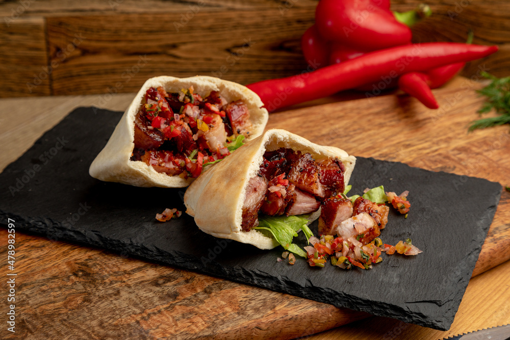 meat tacos with minced meat and vegetables. a traditional dish
