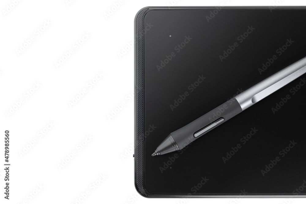 Graphic tablet on a white background. Graphic tablet and pen for retouching close-up. Graphic tablet on a white background. Graphic tablet and pen for retouching close-up.