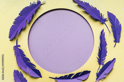 Very pery color of the year 2022. Creative layout paper card with DIY feathers. Handmade paper cut. Template photo