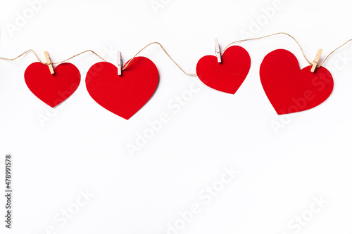 Red hearts background with copy space. Paper cut romantic concept, top view. Valentines Day greeting card concept. White background