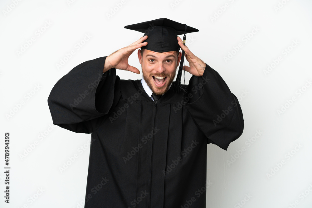 Young university Brazilian graduate isolated on white background with surprise expression Young university Brazilian graduate isolated on white background with surprise expression