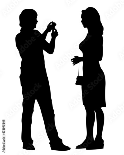 Young people holds a smartphone in her hand. Isolated silhouettes of people on a white background