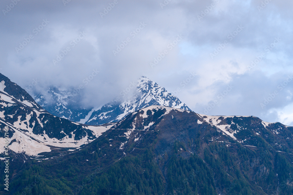Clouds envelop Mont Lachat in the Mont Blanc Massif in Europe, France, the Alps, towards Chamonix, in summer.