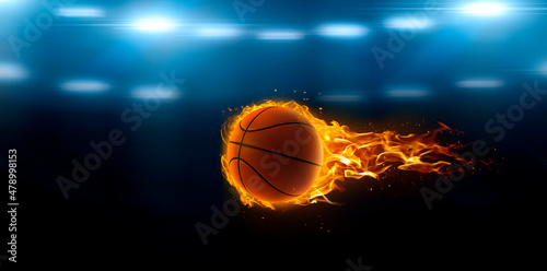 asketball on fire in basketball court stadium with lights in the field shining © Retouch man