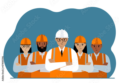 A team of smiling construction workers in white and orange hard hats and orange vests. Engineer and builders. photo