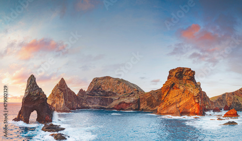 Natural arch, stone rocks and cliffs at dawn from Ponta do Rosto viewpoint, Sao Lourenco Peninsula, Madeira island, Portugal, Atlantic photo