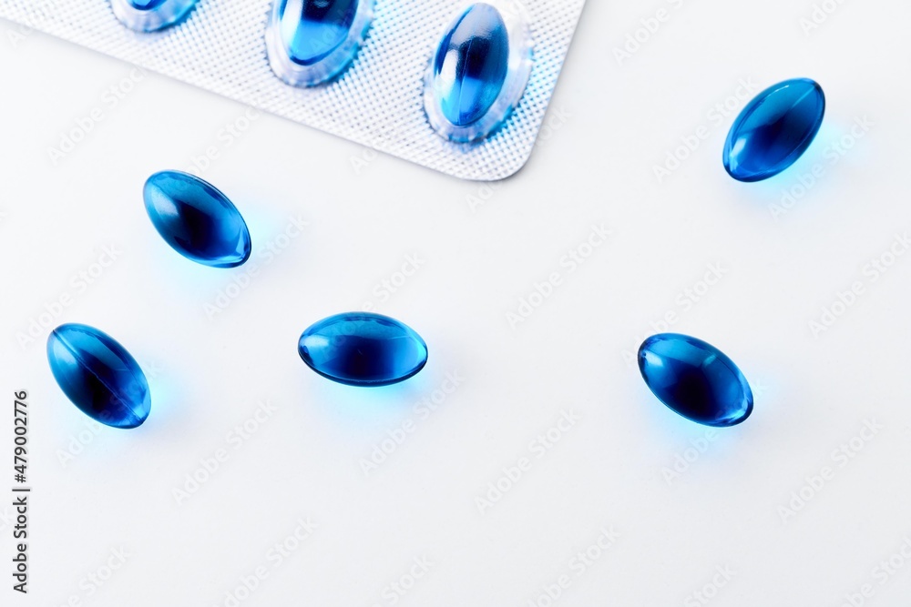 Blue Gel Capsules of Ibuprofen on white background