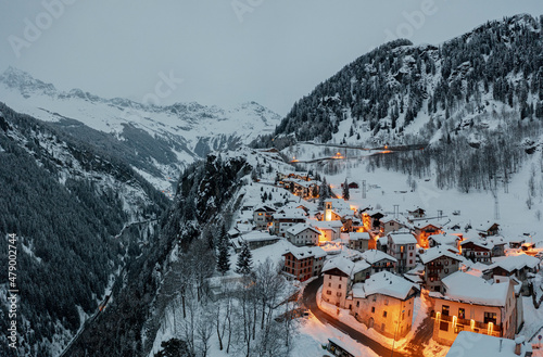 Small village of Pianazzo on top of snowcapped mountain after a snowfall, Madesimo, Valle Spluga, Valtellina, Lombardy, Italy photo