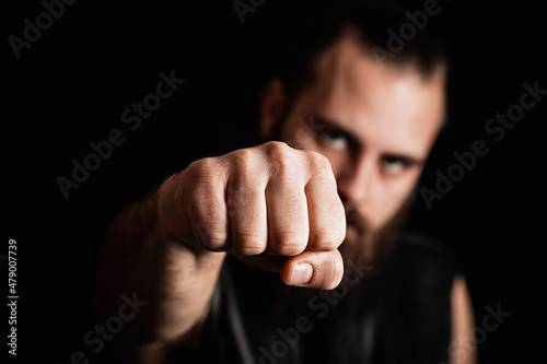 Slika na platnu Biker holding a fist up to the camera