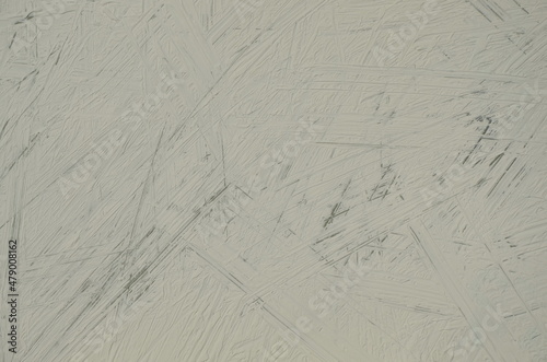 Light background. The texture of the old scratched surface. Dark lines on a light surface. Background for images and stories
