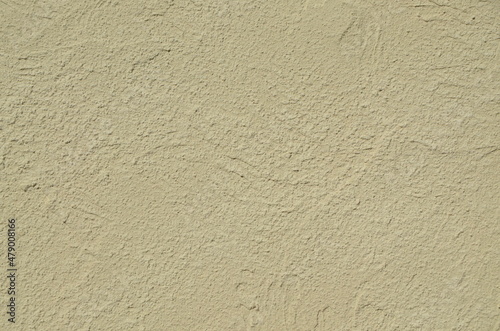 Beige background. The texture of the old plaster wall. Home decoration. Background for the image. Backgrounds for stories.