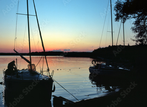 Fototapeta Naklejka Na Ścianę i Meble -  Beldany Lake, sail boat in Piaski marina, Masuria region, Poland