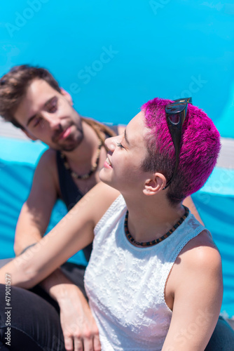 Young couple in love is sitting and enoying of being together. Lifestyle concept