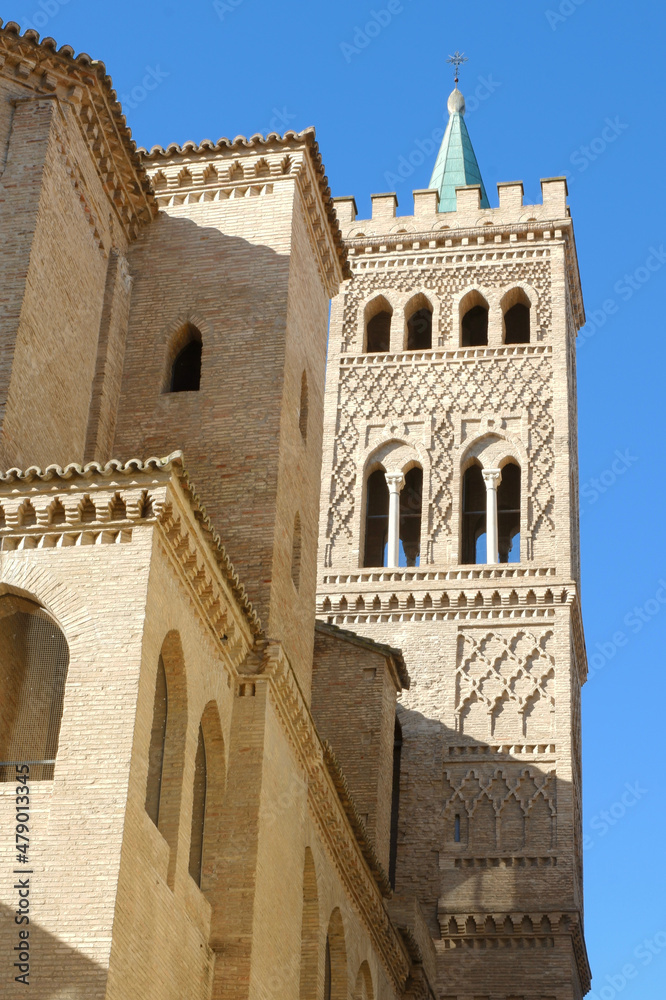 Church tower made in Mudejar architectural style from outside in Zaragoza, Spain. Fort with moorish ornamental details