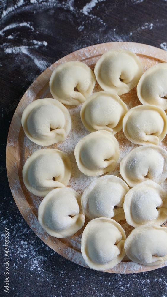 dumplings, a traditional dish of Russian cuisine, made of dough stuffed with minced meat, minced meat, cooking process, modeling, recipe dumplings, a traditional dish of Russian cuisine, made of dough stuffed with minced meat, minced meat, cooking process, modeling, recipe