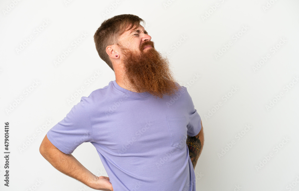 Fototapeta premium Young reddish caucasian man isolated on white background suffering from backache for having made an effort