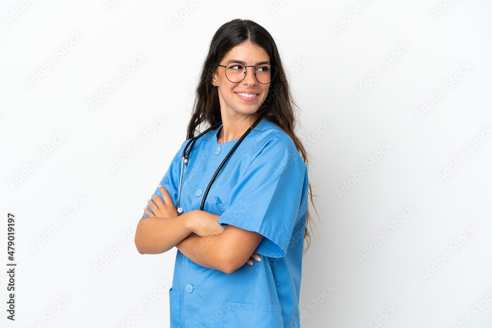 Young surgeon doctor caucasian woman isolated on white background with arms crossed and happy Young surgeon doctor caucasian woman isolated on white background with arms crossed and happy