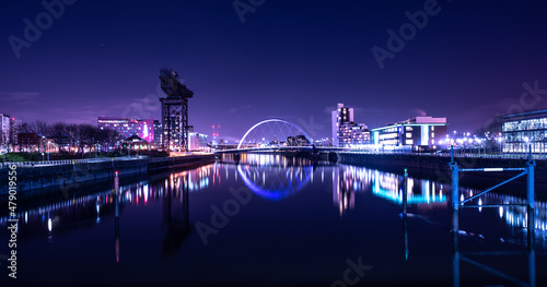 City Riverscape at Night with reflections and purple light