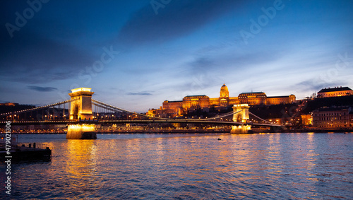 Nightscape of Budacastle, Budapest, Hungary - Széchenyi Chain Bridge - Danube river in the foreground