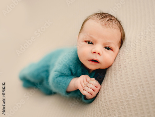 Newborn baby boy studio portrait