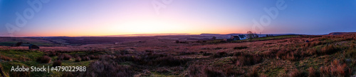 Sunrise across a moor in Yorkshire, with purple and orange tones.