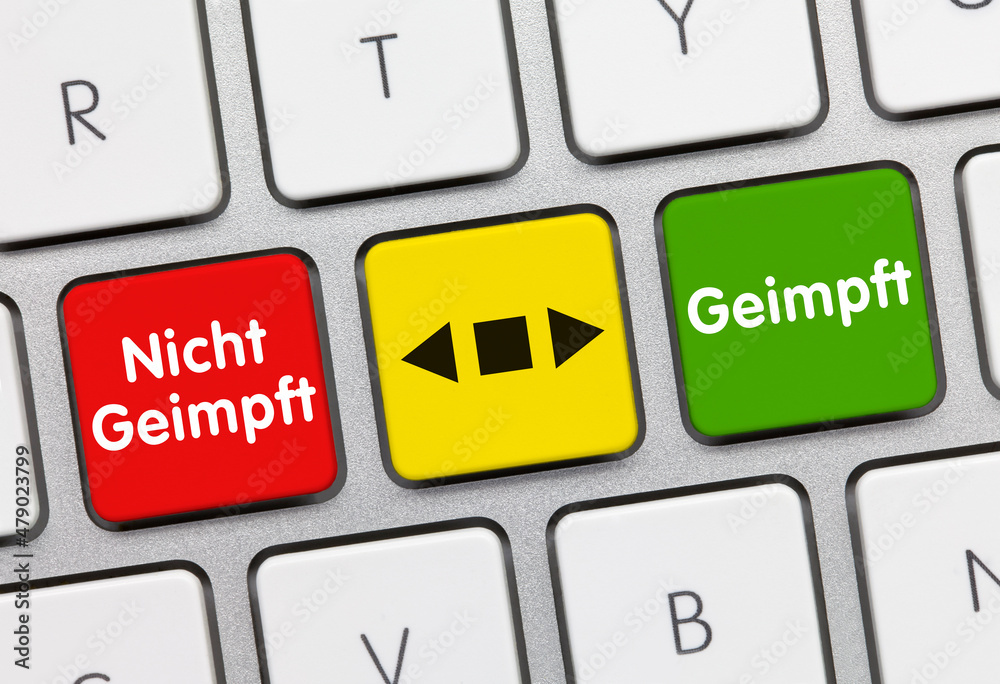 Geimpft - Nicht Geimpft - Wort auf roten taste. Geimpft - Nicht Geimpft - Wort auf roten taste.
