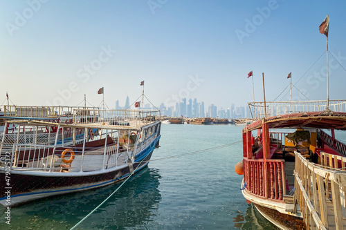 Принти на полотні Cityscape and downtown skyscrapers Doha, Qatar with old dhow boats