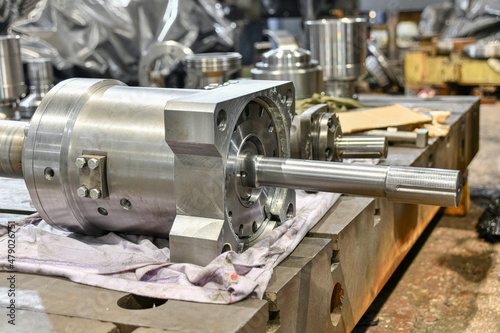 Ground cylinder of a hydraulic pump in a workshop being repaired.