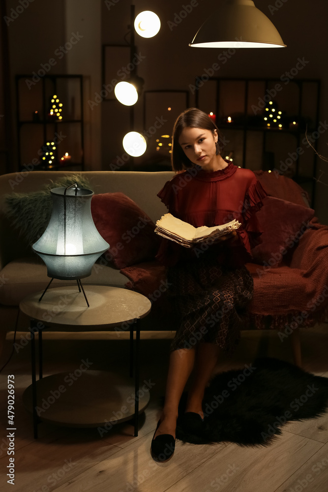 Beautiful woman reading old book at home Beautiful woman reading old book at home