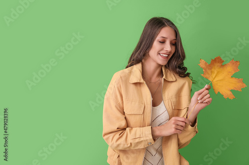 Young smiling woman holding...
