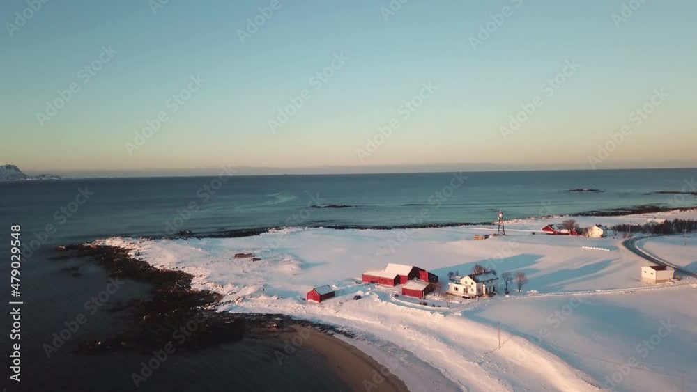 Aerial drone view of a small town on norways andoya peninsula, Winter snow and ice landscape Aerial drone view of a small town on norways andoya peninsula, Winter snow and ice landscape