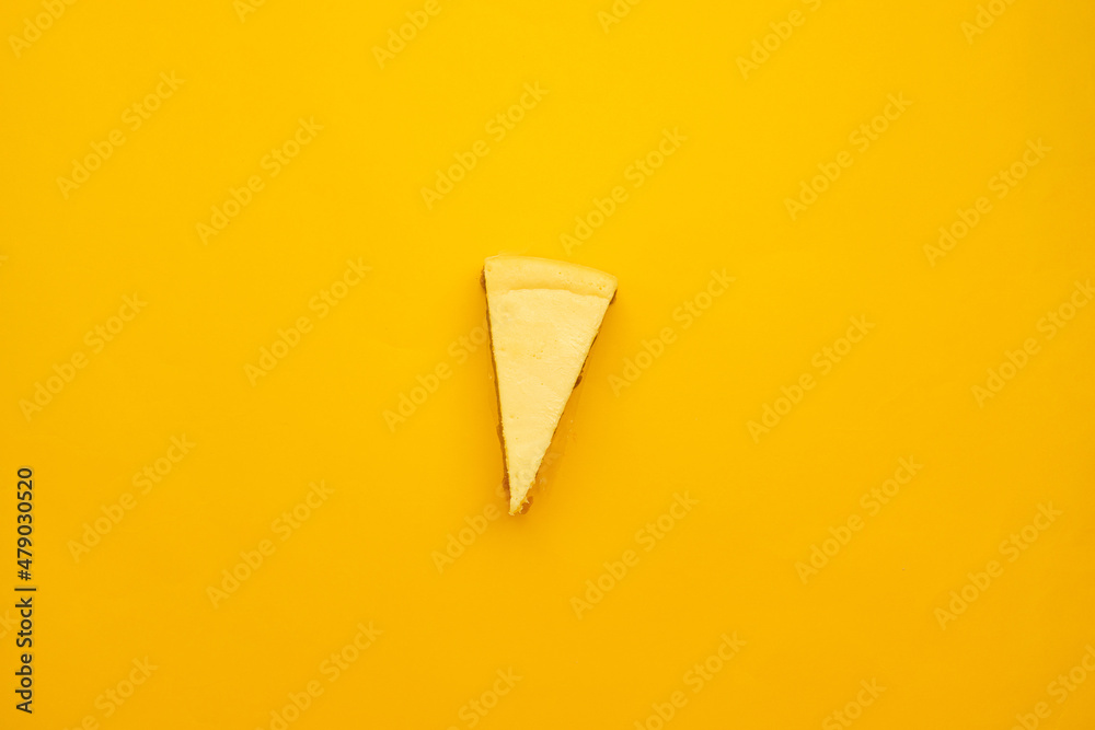 Fotografie, Obraz Piece of tasty cream cheesecake on yellow background