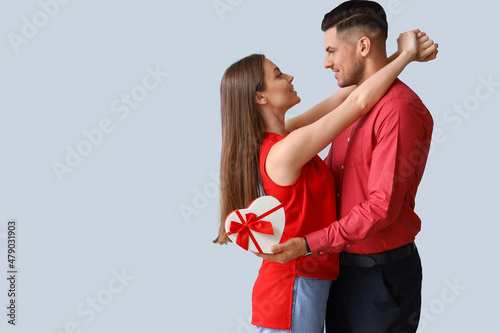 Happy young couple with gif...
