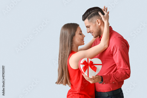 Happy young couple with gif...