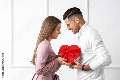 Happy young couple with gif...