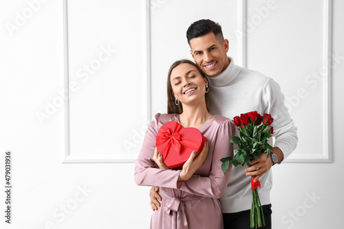 Happy young couple with gif...