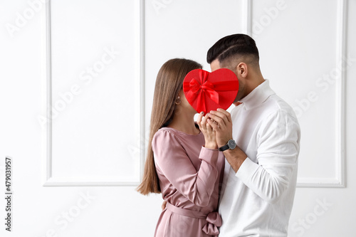 Happy young couple with gif...