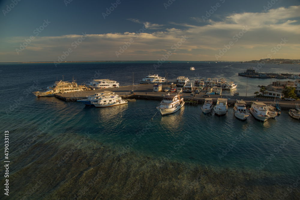 a large number of boats and yachts sway on the waves of the Red Sea in the vicinity of the city of Hurghada