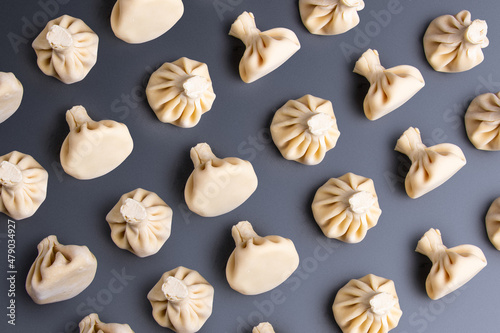 patern with khinkali on a dark background. traditional Caucasian cuisine