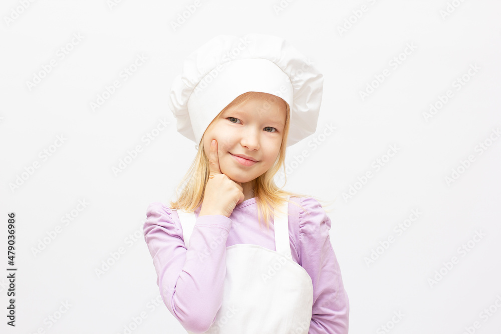 Beautiful little girl in chef uniform isolated on white Beautiful little girl in chef uniform isolated on white