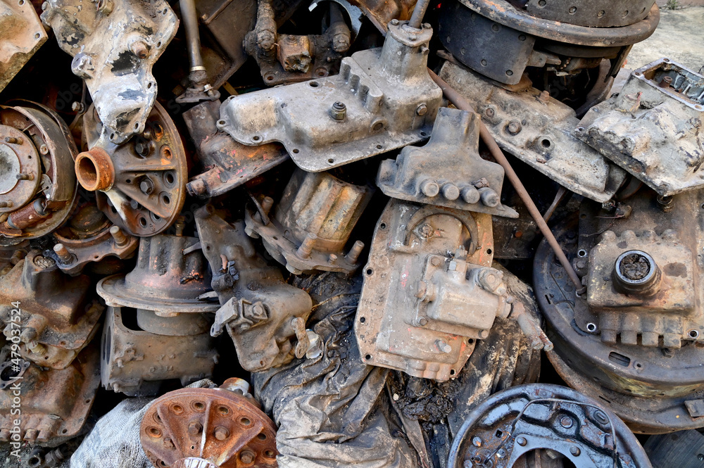 Closeup of Truck and Car Rear Differential, transmission parts, clutch disc, car drum brake on the floor in front of the factory at Thailand. Closeup of Truck and Car Rear Differential, transmission parts, clutch disc, car drum brake on the floor in front of the factory at Thailand.