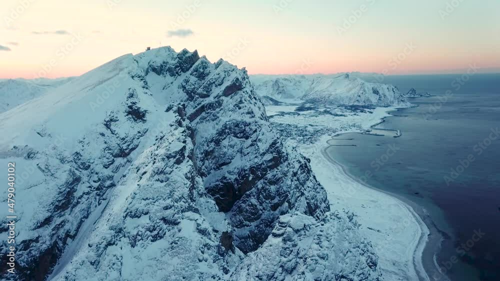 Aerial drone view of norways mountains close to Andenes, Andoya - Winter landscape in snow and ice
