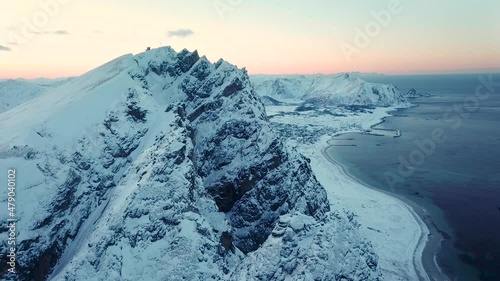 Aerial drone view of norways mountains close to Andenes, Andoya - Winter landscape in snow and ice photo
