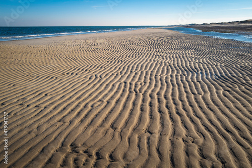 Wide and long rippled sand bar at Scoton Neck Beach in Cape Cod Bay in Massachusetts