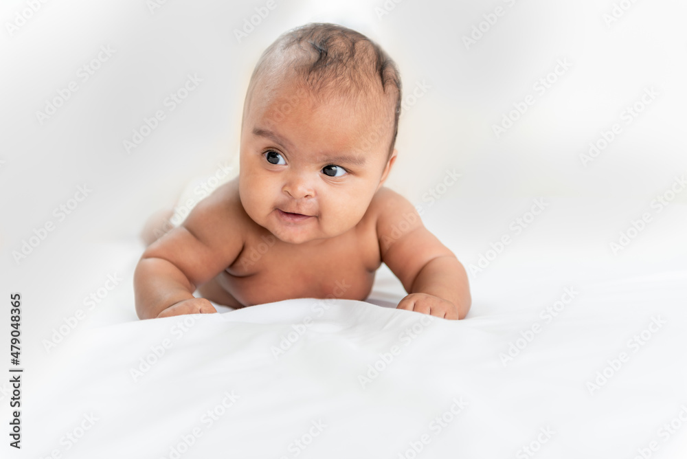 Portrait images of African baby newborn girl is 3 month year old, Lying on white bed in bedroom, to African newborn concept. Portrait images of African baby newborn girl is 3 month year old, Lying on white bed in bedroom, to African newborn concept.