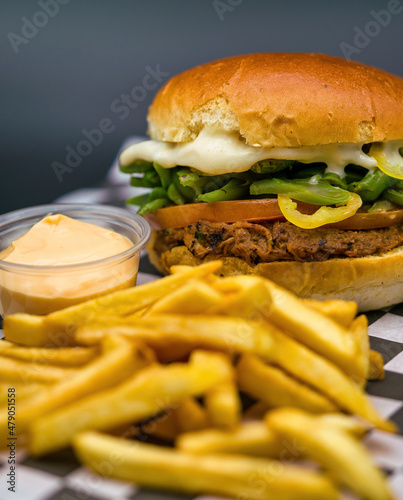 Shredded meat sandwich with tomato, green beans, green pepper and mayonnaise. served with french fries (chacarero)
