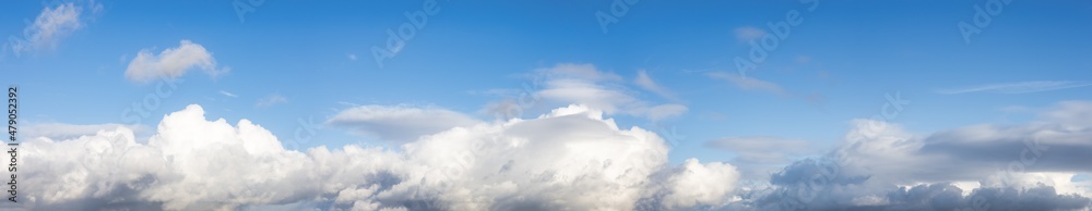 Panoramic View of Cloudscape during a cloudy blue sky sunny day. Taken on the West Coast of British Columbia, Canada. Panoramic View of Cloudscape during a cloudy blue sky sunny day. Taken on the West Coast of British Columbia, Canada.