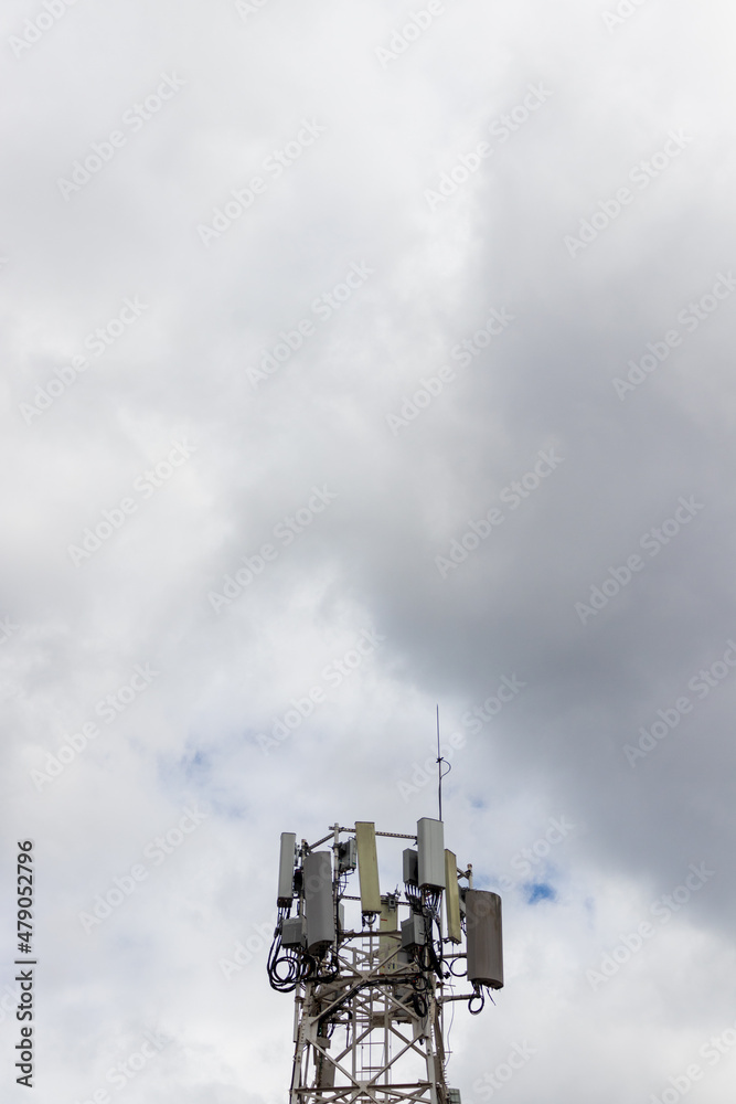 telecommunications tower on a cloudy sky