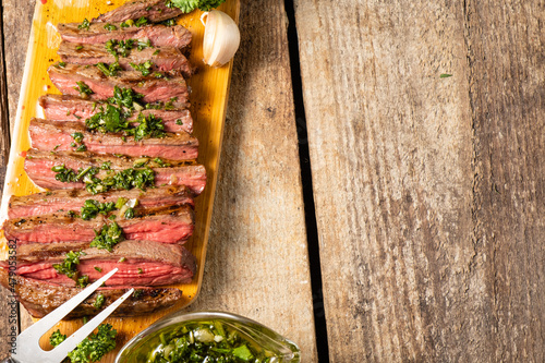 Juicy steak cooked and sliced top view, free space on the right.