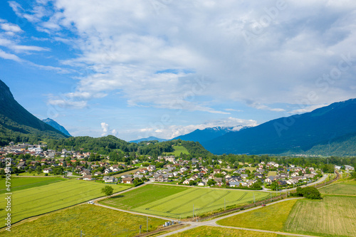 The town of Gresy sur Isere surrounded by mountains in Europe, France, Isere, the Alps, in summer on a sunny day.